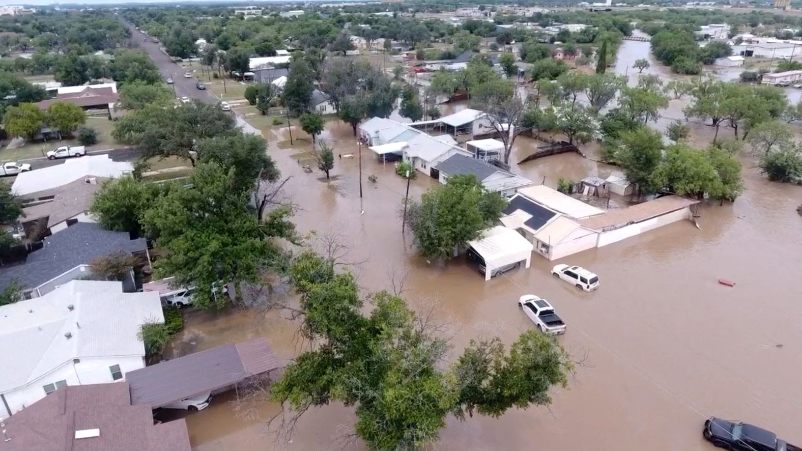 Flooded houses and streets are seen in San Angelo, Texas, on Friday, June 4.