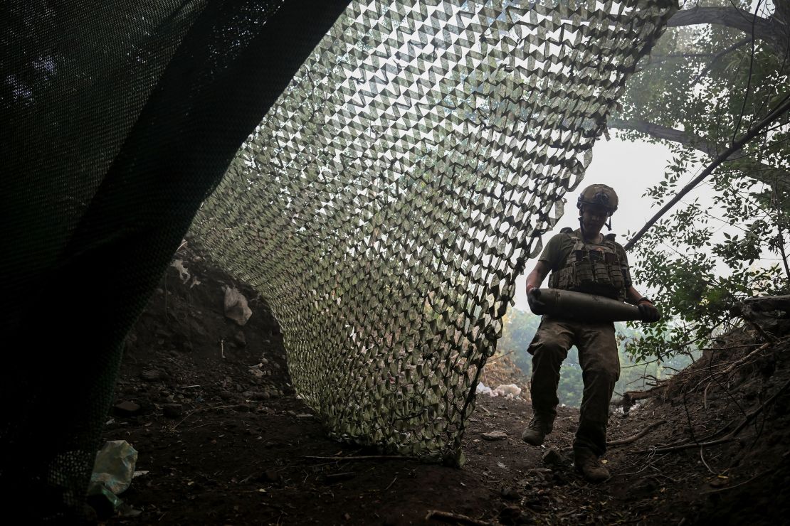 An artilleryman of the 93rd Kholodnyi Yar Separate Mechanized Brigade of the Ukrainian Armed Forces carries a shell as he prepares to fire a M109 Paladin self-propelled howitzer towards Russian troops, amid Russia's attack on Ukraine, near the city of Kostiantynivka in Donetsk region, Ukraine July 5, 2025.