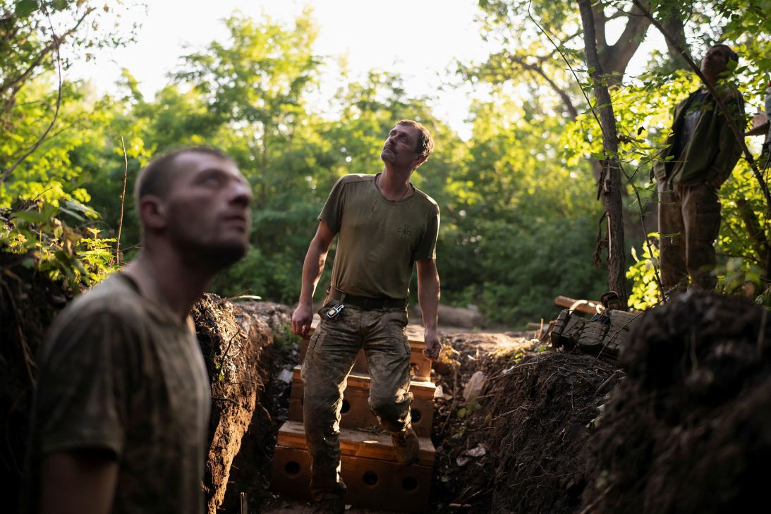 Artillerymen of the 93rd Kholodnyi Yar Separate Mechanized Brigade of the Ukrainian Armed Forces look out for Russian combat drones, at a front-line position on a front line near the city of Kostiantynivka in tje Donetsk region of Ukraine, on July 5.