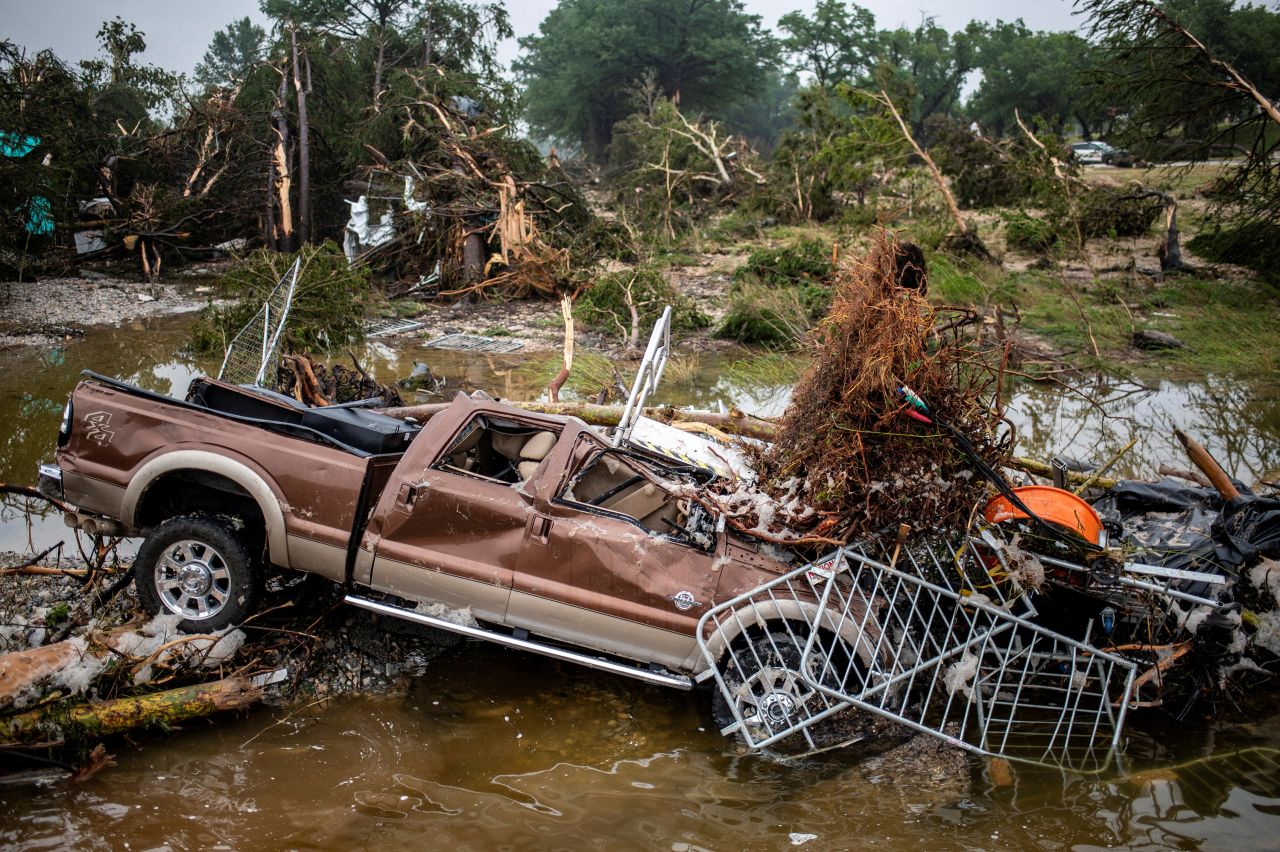 A pickup truck sits damaged after flooding in Kerrville, Texas, on Saturday.
