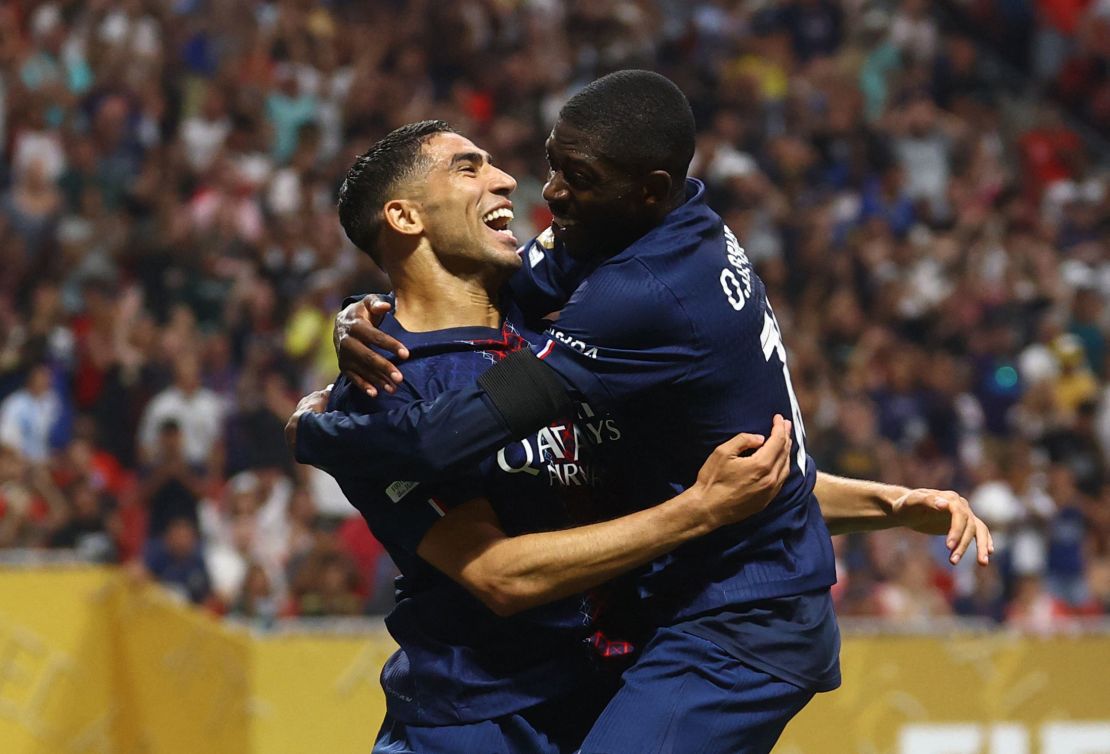 Achraf Hakimi and Ousmane Dembélé celebrate the goal which sealed PSG's place in the semifinals.