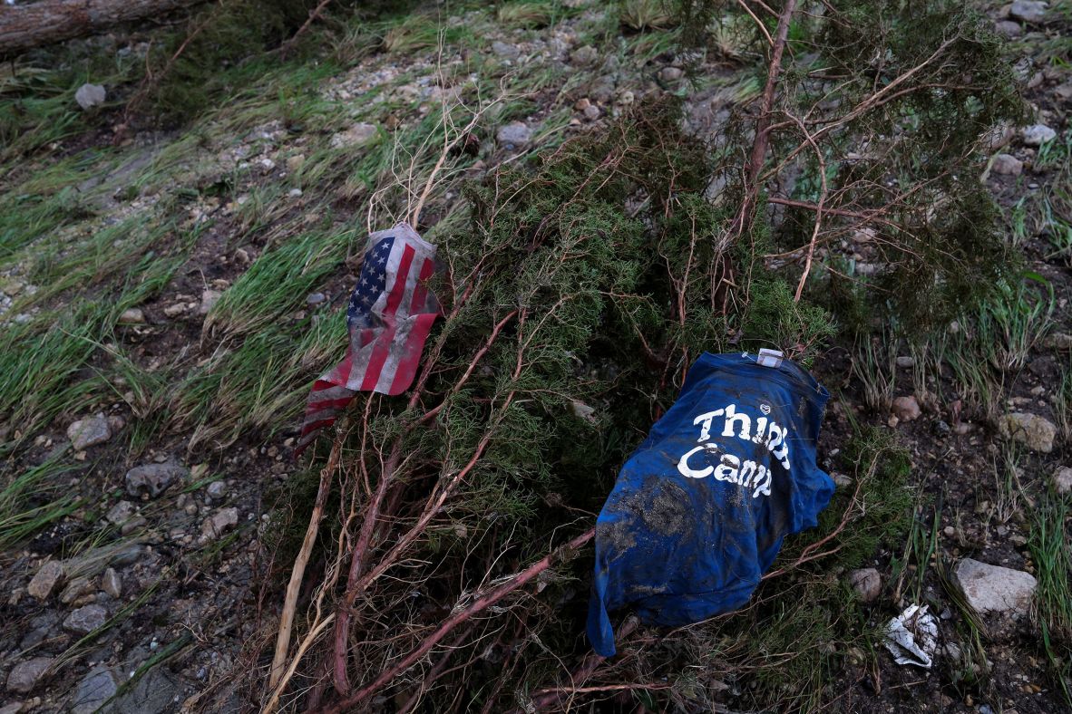 An American flag and a shirt lie on the ground in Hunt on Sunday.