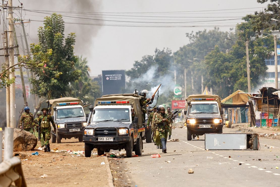 Riot police leave their vehicles during clashes in Nairobi on July 7, 2025.