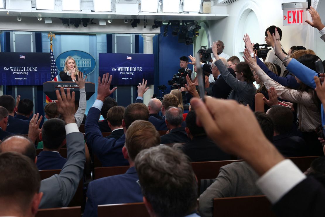 Members of the media raise their hands to ask questions as White House press secretary Karoline Leavitt holds a press briefing at the White House in Washington, DC, on Monday, July 7.
