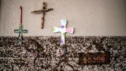 Crosses hang on a wall with flood marks at Camp Mystic in the aftermath of deadly flooding in Kerr County on July 7, 2025.