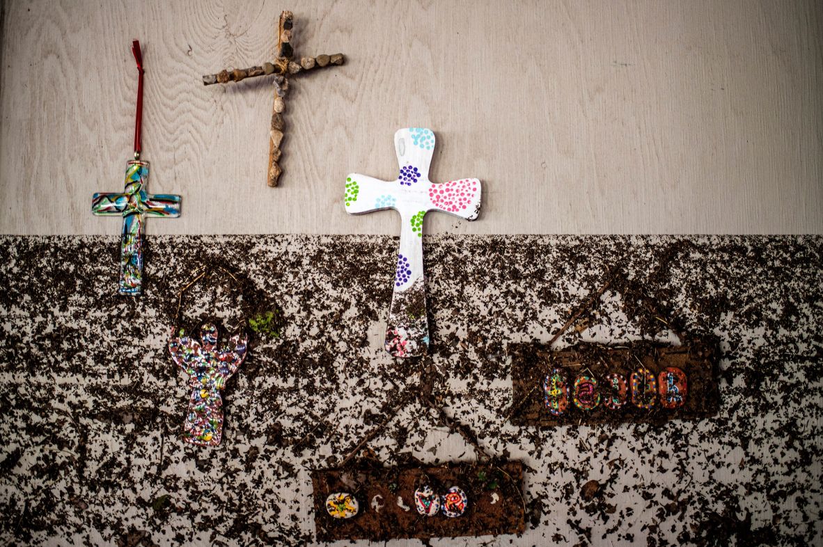 Mud left by floodwaters partially covers a wall at Camp Mystic on Monday.