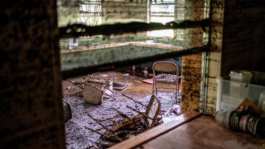 Chairs lie inside a damaged room in a cabin at Camp Mystic in the aftermath of deadly flooding in Kerr County, Texas, U.S., July 7, 2025.   REUTERS/Sergio Flores
Chairs covered in mug lie inside a damaged cabin at Camp Mystic in Kerr County, Texas, on July 7.