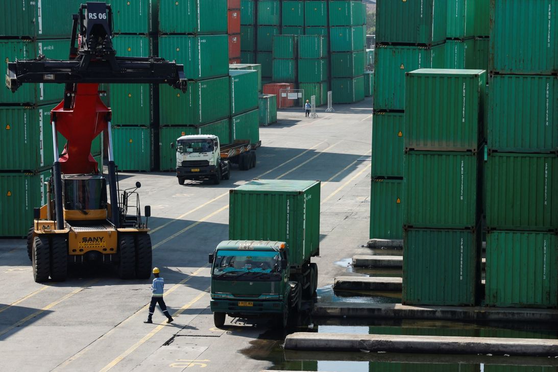 A container truck is unloaded from a truck at Tanjung Priok Port, following the announcement that US President Donald Trump would impose tariffs of 32% on goods from Indonesia, in North Jakarta, Indonesia on July 8, 2025.