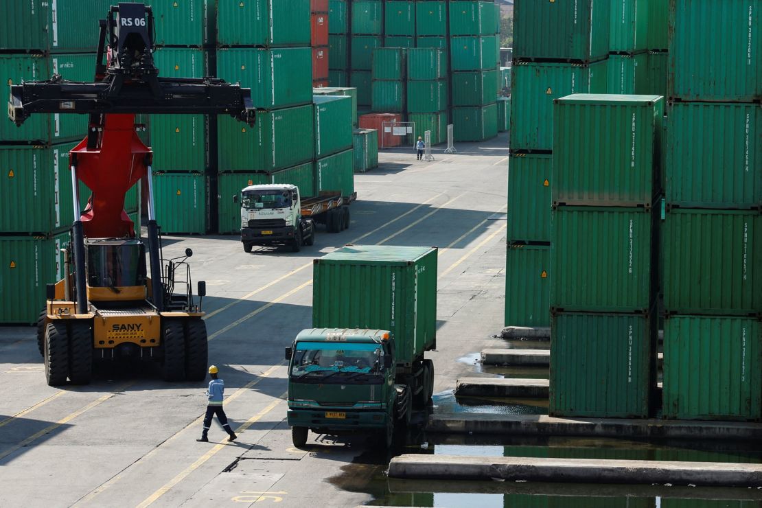 A container truck is unloaded from a truck at Tanjung Priok Port in Indonesia. Goods shipped from Indonesia to the United States will soon face 19% tariffs.