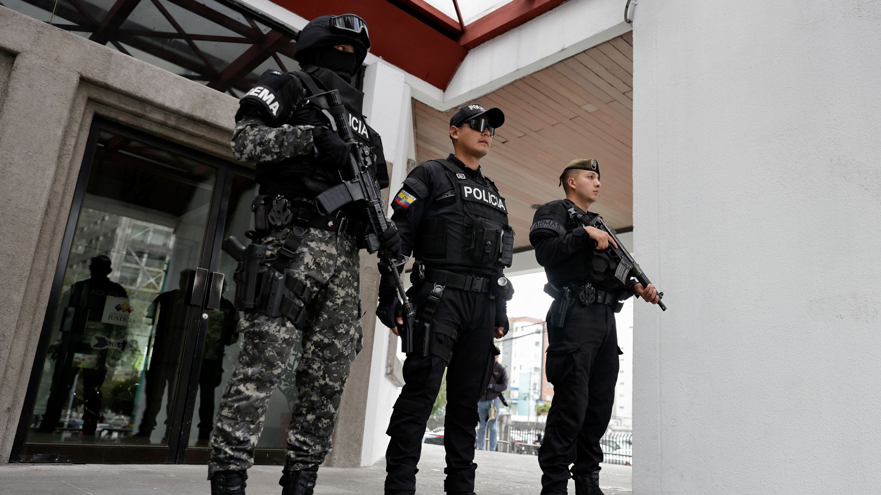 Security forces stand outside the National Court of Justice following a hearing for the extradition of Ecuadorean gang leader Jose Adolfo Macías, known as "Fito," who accepted the court's request to be extradited to the United States to face drug and gun charges, in Quito, Ecuador.