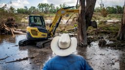 Machinery is used to clear debris along the banks of the Guadalupe River after catastrophic floods in Center Point, Texas, on July 11.