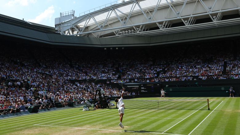Tennis - Wimbledon - All England Lawn Tennis and Croquet Club, London, Britain - July 13, 2025 Spain's Carlos Alcaraz serves during the men's singles final against Italy's Jannik Sinner REUTERS/Toby Melville