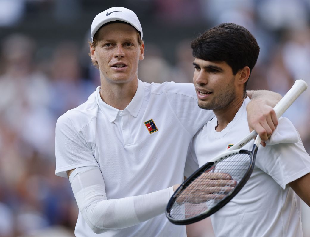 Jannik Sinner and Carlos Alcaraz embrace after their Wimbledon final in July. Sinner won in four sets.