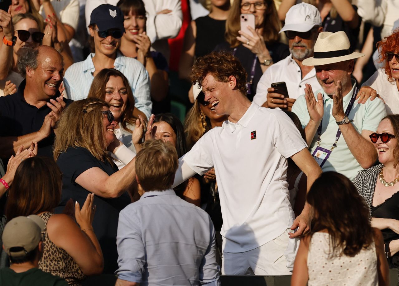 Sinner celebrates with his mother, Siglinde, after the match.