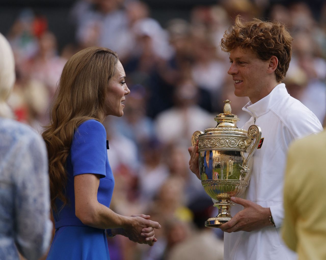 Catherine, Princess of Wales, presents Jannik Sinner with the winner's trophy.