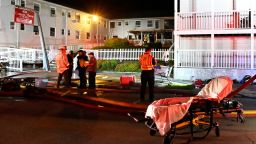 Firefighters view the scene at Gabriel House Assisted Living Facility, after a deadly fire broke out in Fall River, Massachusetts, Sunday.