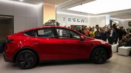 Media personnel take pictures and videos of the TESLA Model Y car at India's first Tesla showroom in Mumbai, India, July 15, 2025.