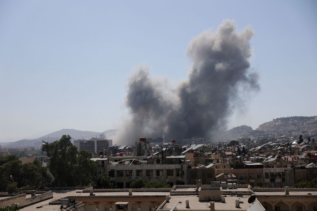 Smoke rises after an airstrike on Syria's defense ministry in Damascus on Wednesday.