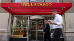 FILE PHOTO: People walk by a Wells Fargo bank branch in New York City, U.S., June 4, 2025. REUTERS/Kylie Cooper/File Photo