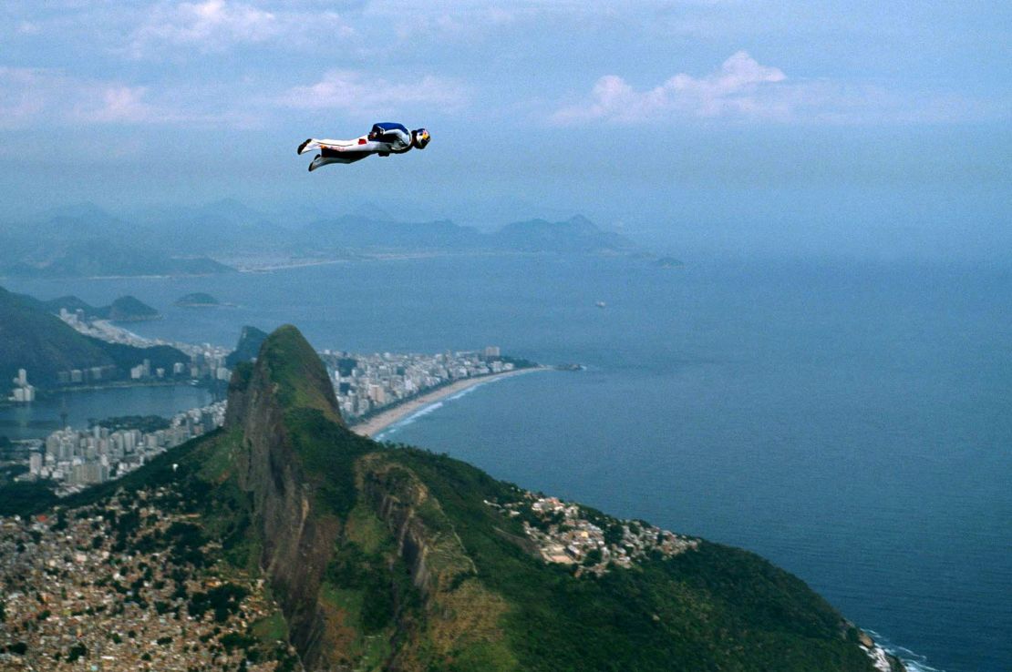 Felix Baumgartner glides through the air past the Dois Irmaos peaks in Rio de Janeiro in 2001.