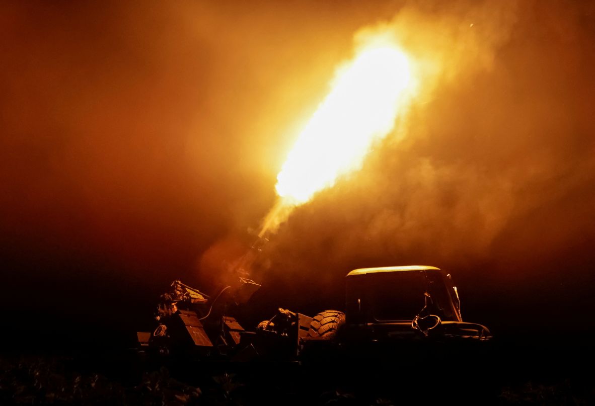 A Ukrainian serviceman fires an anti-aircraft gun at a Russian drone in Ukraine’s Kharkiv region on Thursday, July 17.