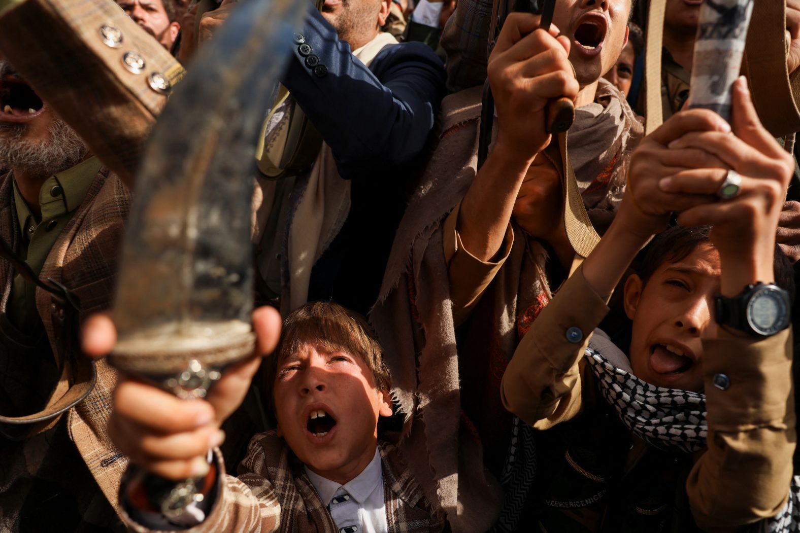 Children in Sanaa, Yemen, react as protesters, predominantly Houthi supporters, show solidarity with Palestinians on Friday, July 18.