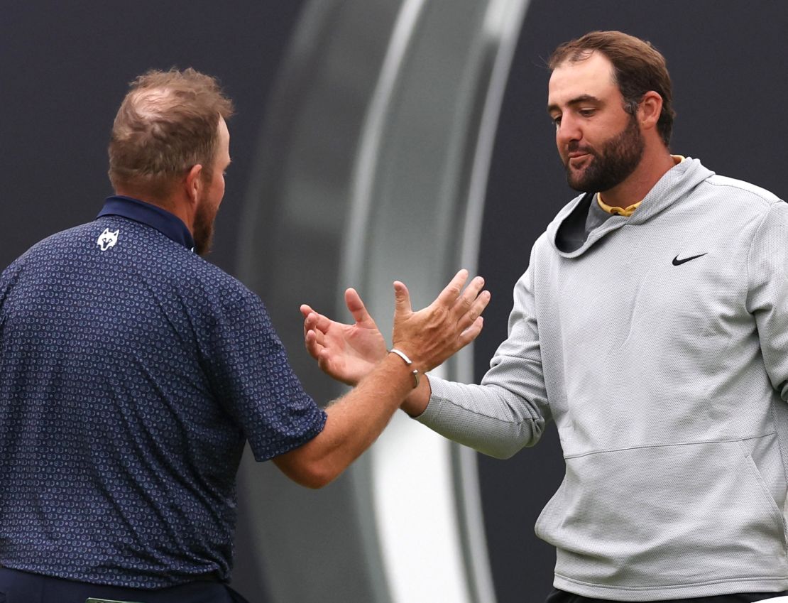 Scottie Scheffler of the U.S., pictured shaking hands with Ireland's Shane Lowry, said Lowry wad been put in a "tough situation."