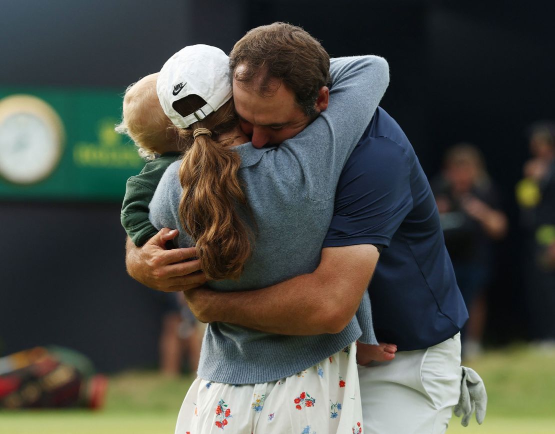 Scottie Scheffler hugs his wife Meredith and son Bennett.