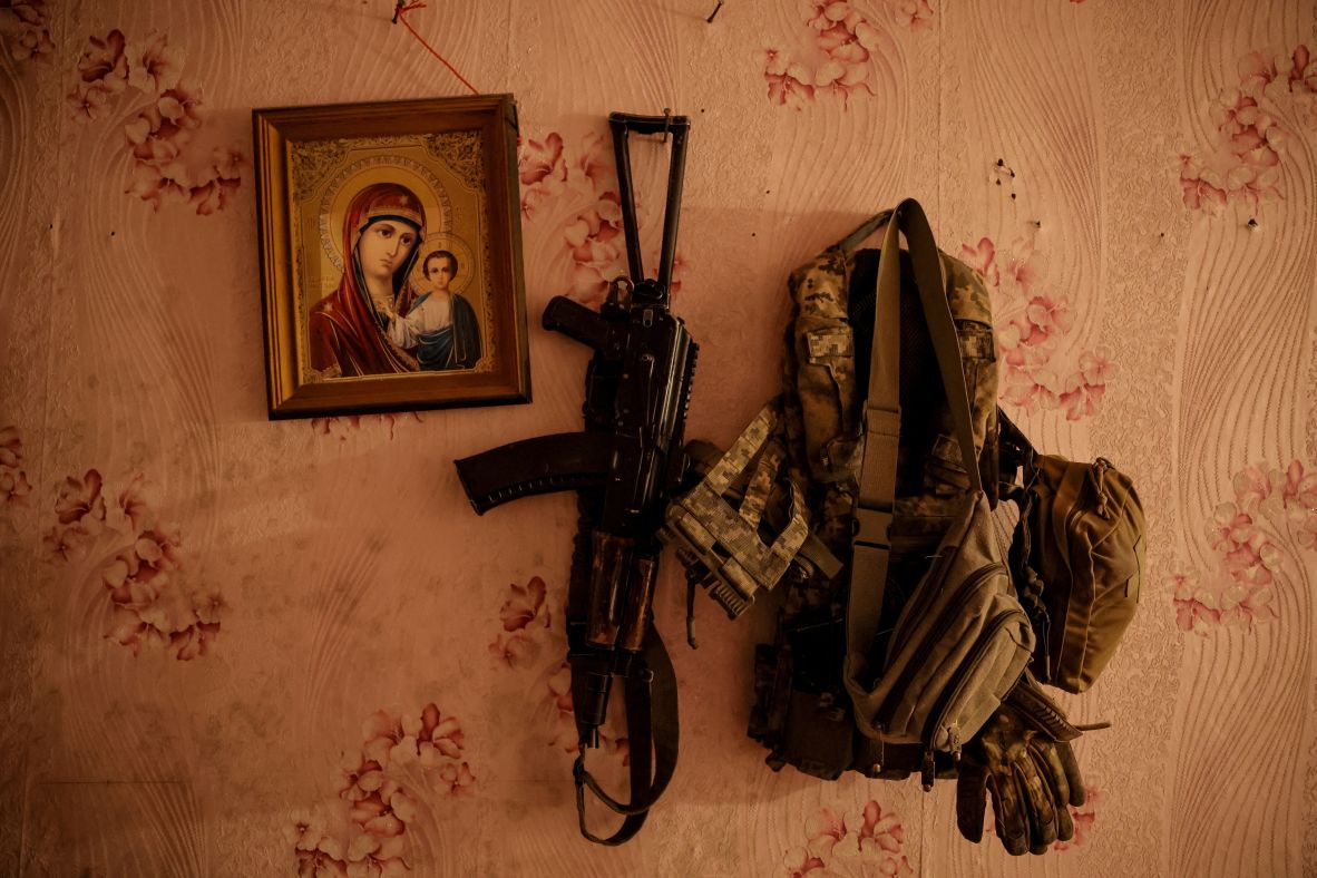 A machine gun and flak jacket, belonging to a Ukrainian serviceman, hang on a wall near the Ukrainian town of Chasiv Yar on Tuesday, July 22. Chasiv Yar is on the front lines of the country’s war with Russia.