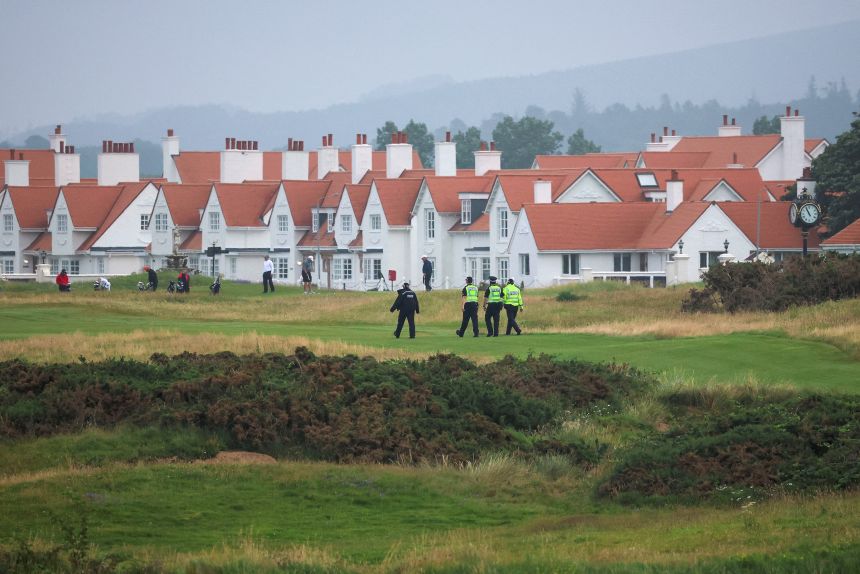 Police officers patrol on the Turnberry golf course ahead Trump's arrival on Friday.