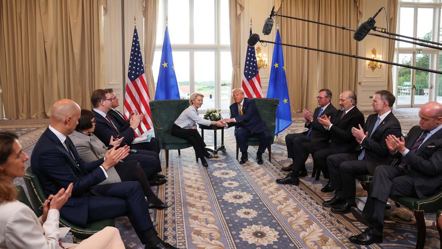 President Donald Trump shakes hands with European Commission President Ursula von der Leyen, as US Commerce Secretary Howard Lutnick, US Trade Representative Jamieson Greer and White House Deputy Chief of Staff Stephen Miller clap after an announcement of a trade deal between the US and EU in Turnberry, Scotland, on July 27.
