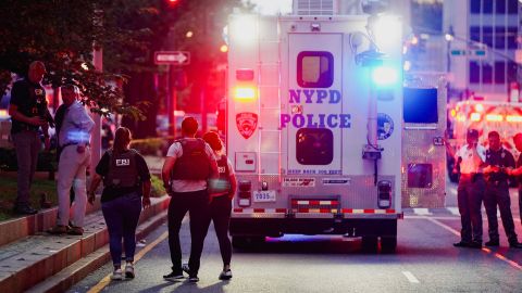 FBI agents investigate near a New York Police Department (NYPD) response vehicle near the scene of a reported shooter situation in the Manhattan borough of New York City, U.S. July 28, 2025. REUTERS/Bing Guan