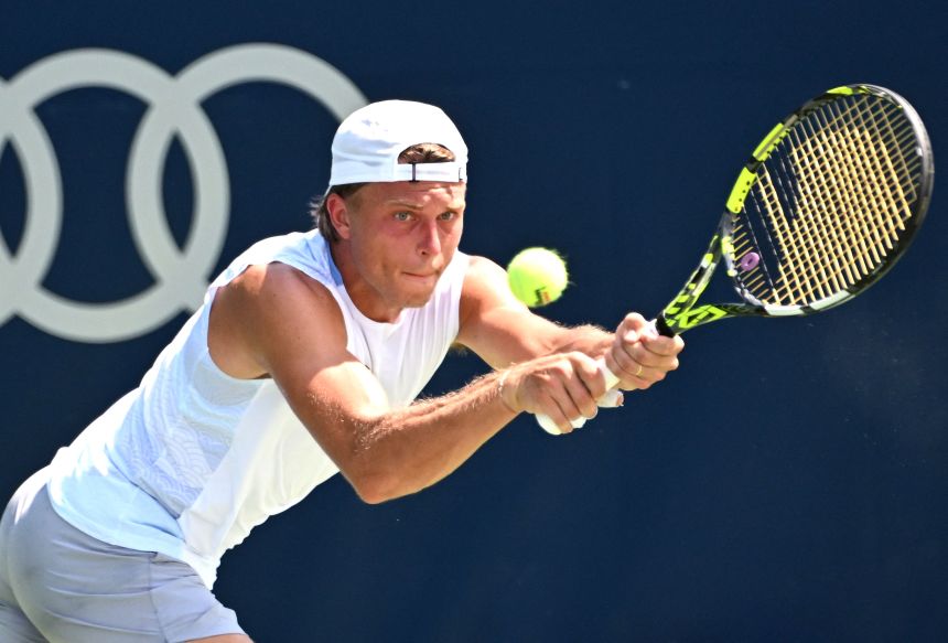 Alexandre Muller plays a shot against Miomir Kecmanovic during second round play at Sobeys Stadium in Toronto on July 29.