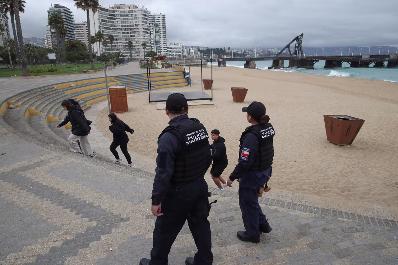 Maritime police officers operate during an evacuation of the coastline following a tsunami advisory generated by local authorities in Vina del Mar, Chile, on Wednesday.