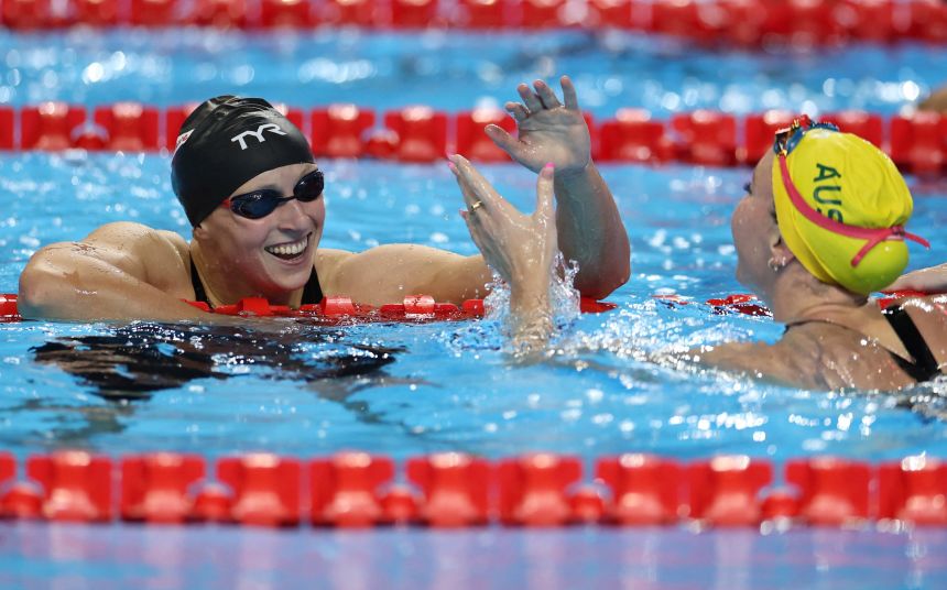 Katie Ledecky celebrates winning the 800m freestyle world title.