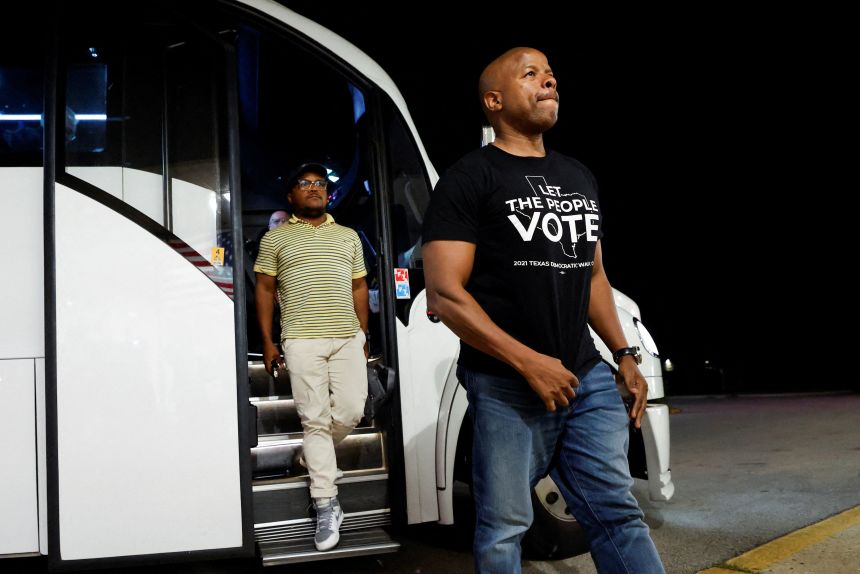 Democratic lawmakers from Texas arrive for a news conference with Illinois Governor J.B. Pritzker, after leaving their state to deny Republicans the quorum needed to redraw the state's 38 congressional districts, in Carol Stream, Illinois, August 3, 2025.