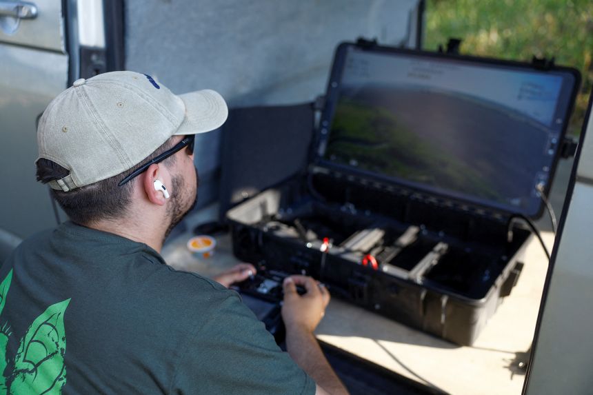 A service member of the 1129th Bilotserkivskyi Anti-Aircraft Missile Regiment operates an interceptor FPV-drone in Ukraine's Dnipropetrovsk region, on July 8, 2025.