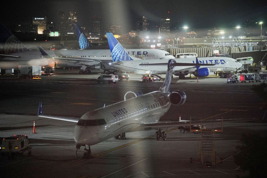 United Airlines planes sit grounded at Newark Liberty International Airport in Newark, New Jersey, on August 6.