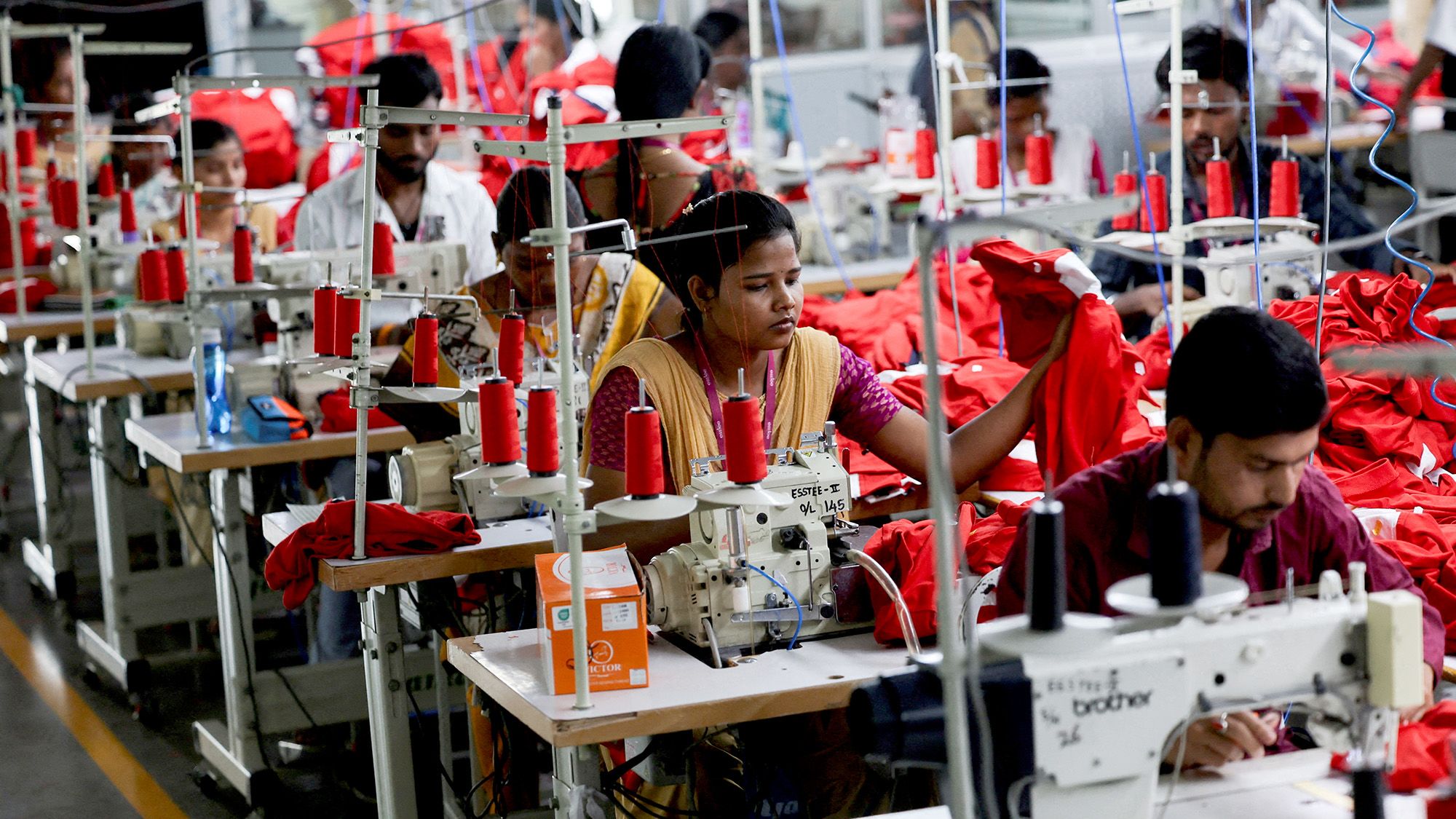 FILE PHOTO: People work at a garment factory in Tiruppur, in the Southern state of Tamil Nadu, India, April 23, 2025. REUTERS/Francis Mascarenhas/File Photo