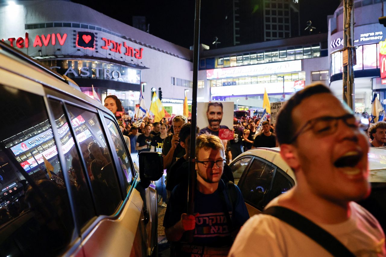 People protest in Tel Aviv on Thursday.