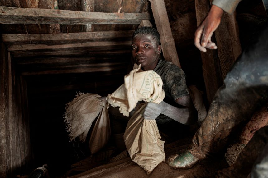 A miner holds a sack of ore as it comes out from the mine shaft at Rubaya coltan mine, near the town of Rubaya, which is controlled by M23 rebels, in eastern DR Congo, on March 24, 2025. REUTERS/Zohra Bensemra
