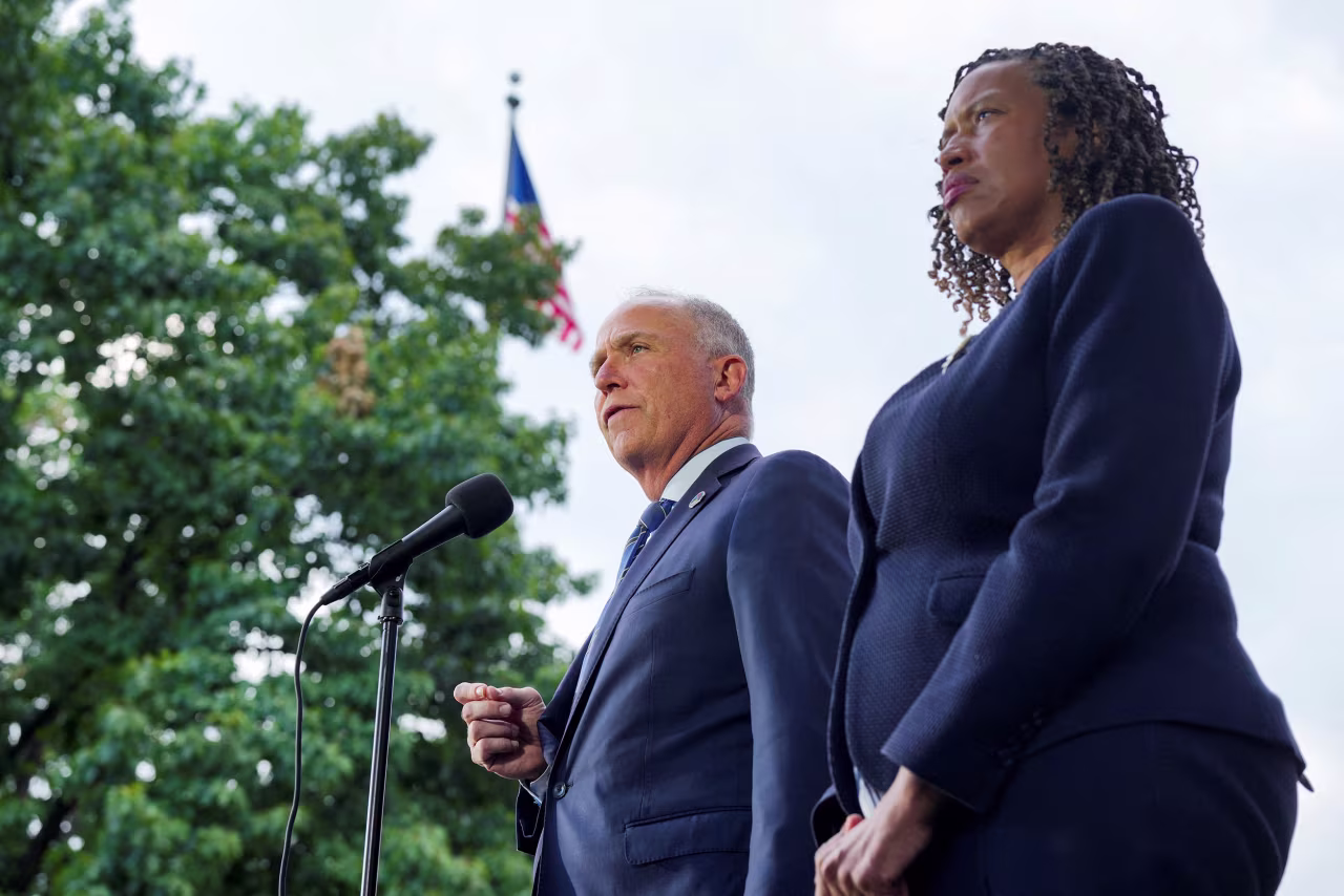 DC Attorney General Brian Schwalb, and DC Mayor Muriel Bowser give a statement to the press following a conclusion of a court session in Washington, DC, on Friday.