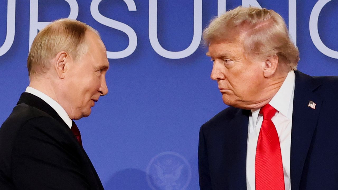 U.S. President Donald Trump and Russian President Vladimir Putin look at each other during a press conference following their meeting to negotiate an end to the war in Ukraine, at Joint Base Elmendorf-Richardson, in Anchorage, Alaska, August 15, 2025.
