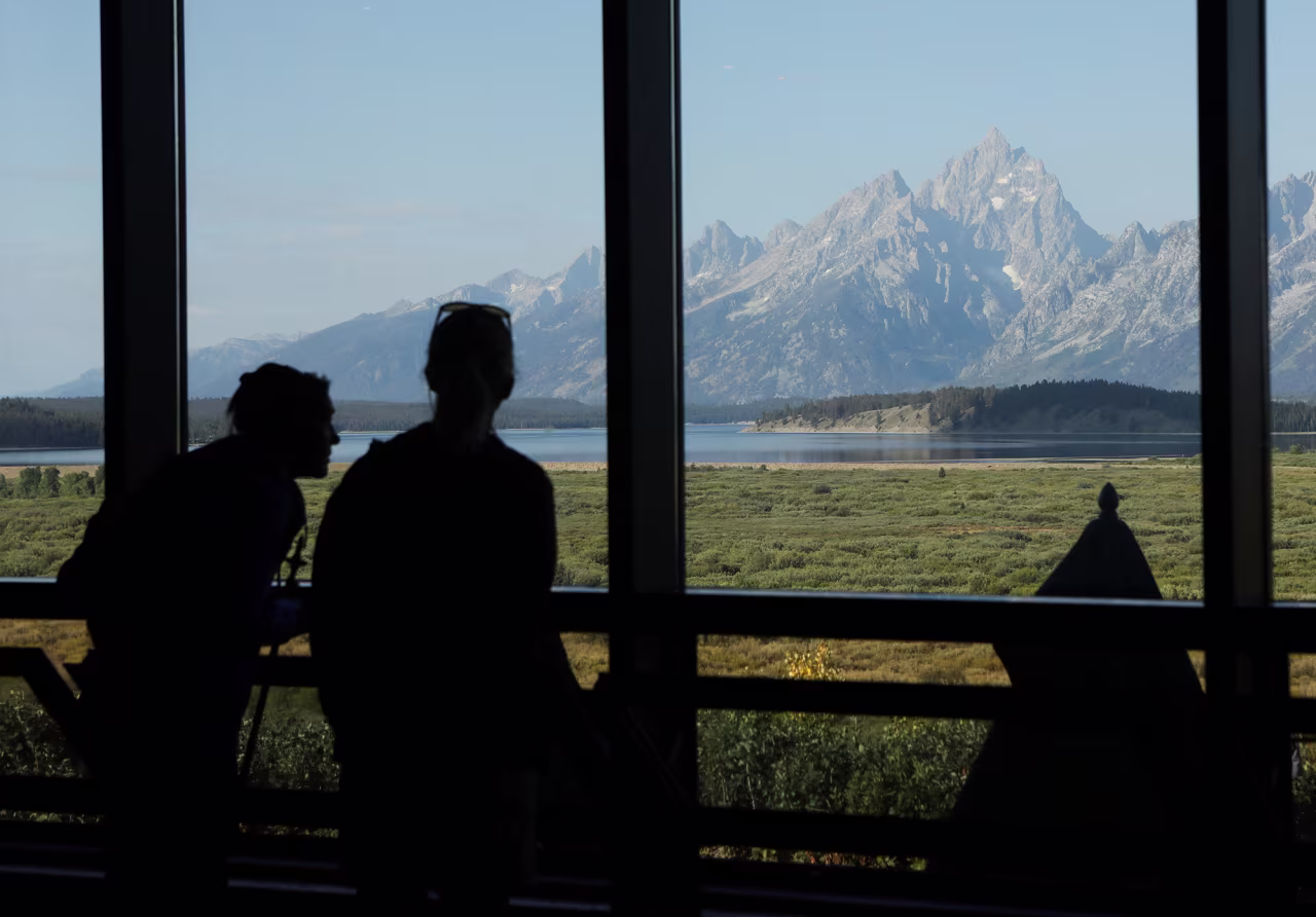 People take in the view while the Federal Reserve Bank of Kansas City's 2025 Jackson Hole Economic Policy Symposium takes place in Jackson Hole, Wyoming, on Thursday.
