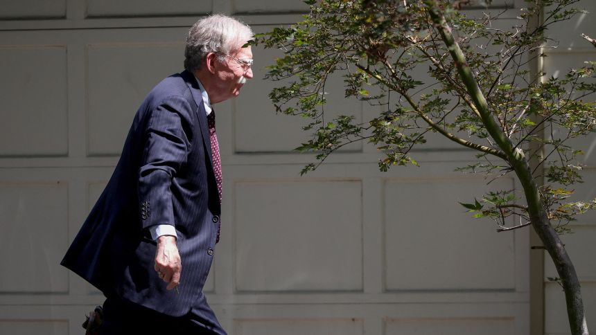 Former White House national security adviser John Bolton arrives at his house following its search by the FBI, in Bethesda, Maryland, U.S., August 22, 2025. REUTERS/Tasos Katopodis