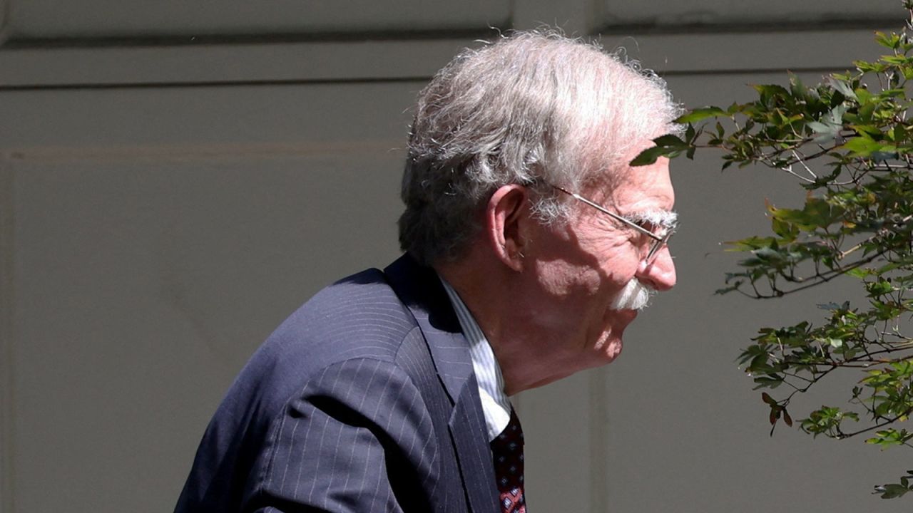 Former White House national security adviser John Bolton arrives at his house in Bethesda, Maryland, following its search by the FBI on August 22, 2025.