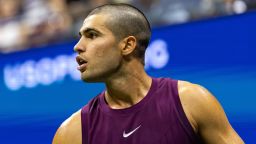 Aug 25, 2025; Flushing, NY, USA; Carlos Alcaraz of Spain in action against Reilly Opelka of the United States in the first round of the men’s singles at the US Open at Arthur Ashe Stadium in Billie Jean King National Tennis Centre. Mandatory Credit: Mike Frey-Imagn Images
