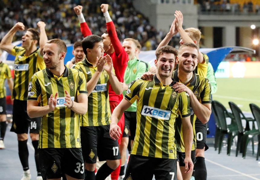 Almaty players celebrate defeating Celtic and reaching the Champions League.