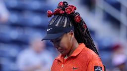 Naomi Osaka wore a rose-themed outfit for her first round match against Belgium's Greet Minnen at the US Open.