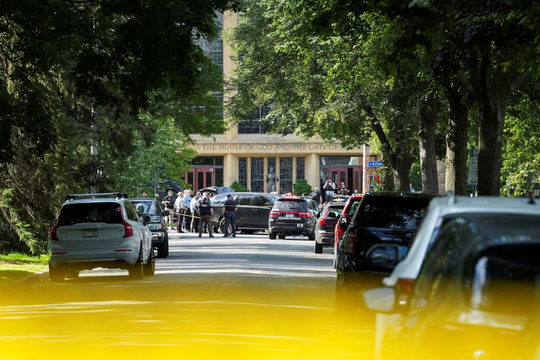 Law enforcement officers gather outside the church Wednesday.